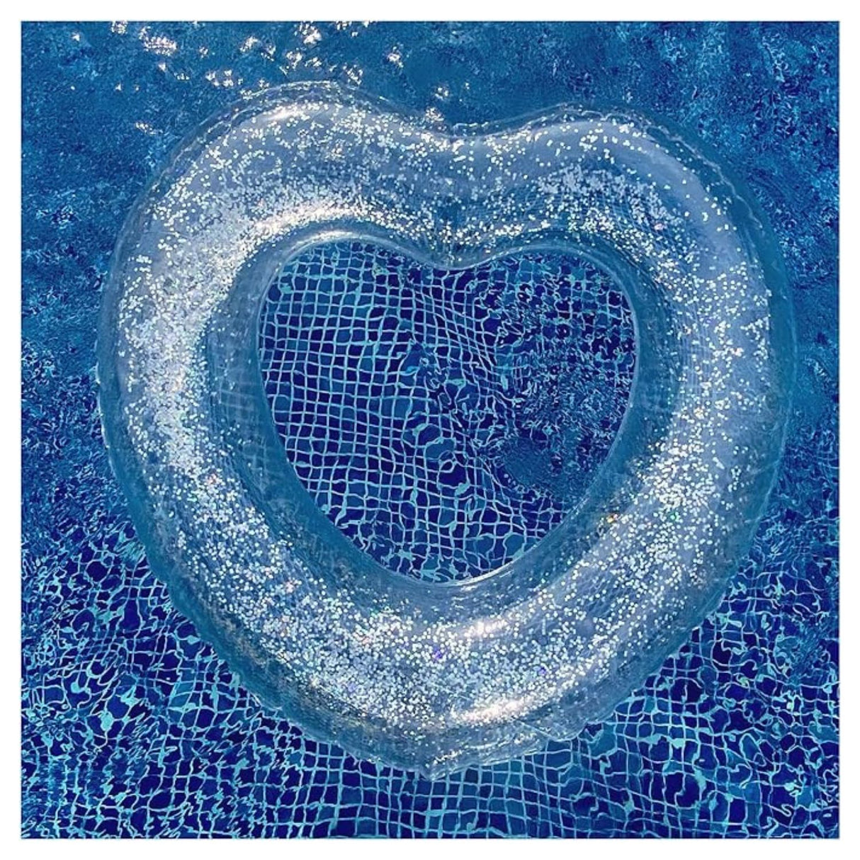 Flotador Corazón Inflable Brillos Plateado 90cm. Diseño llamativo y resistente, ideal para disfrutar en la piscina o la playa. ¡Compra ahora!-3