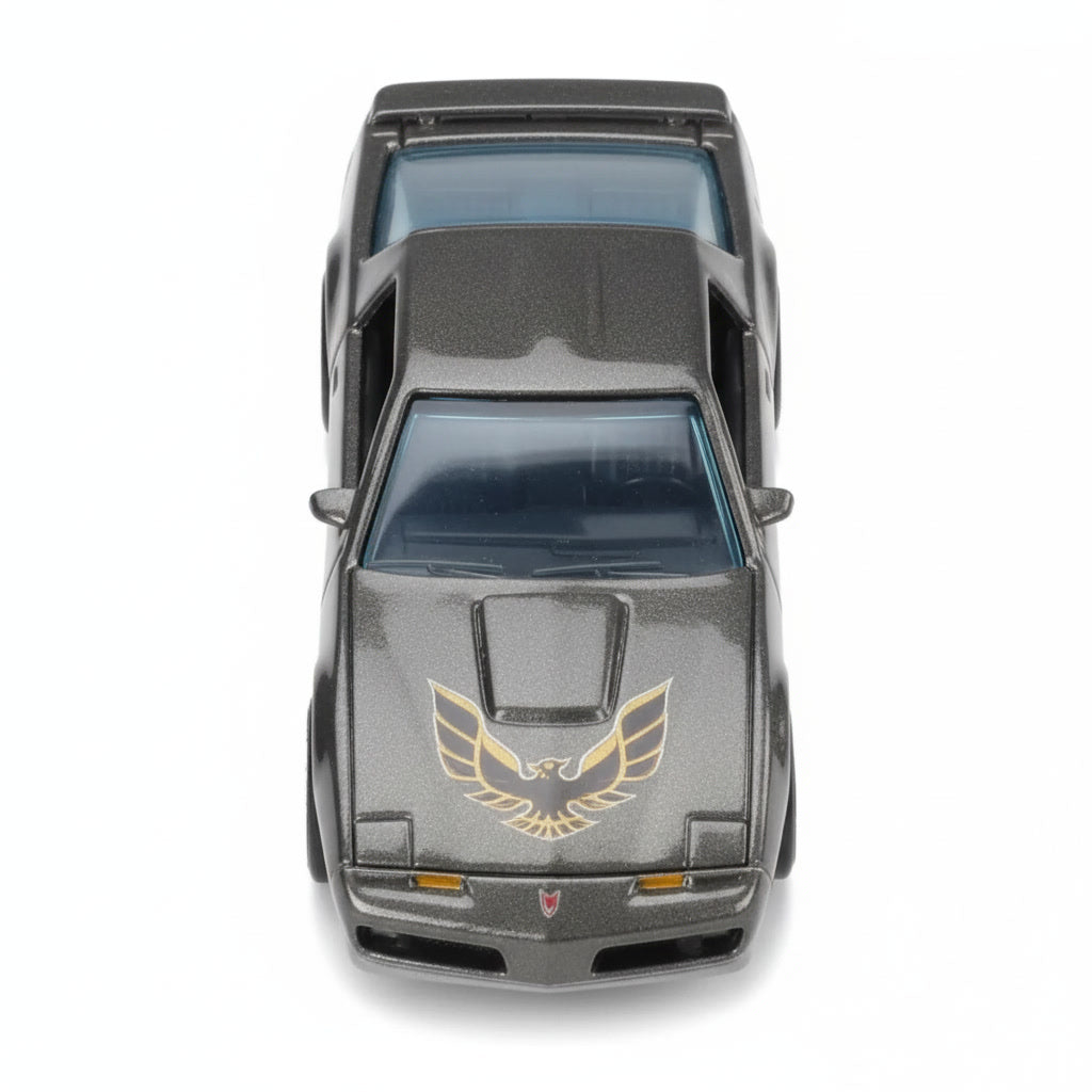 Lateral del modelo diecast Pontiac Firebird 1984 negro Hot Wheels Silver Series