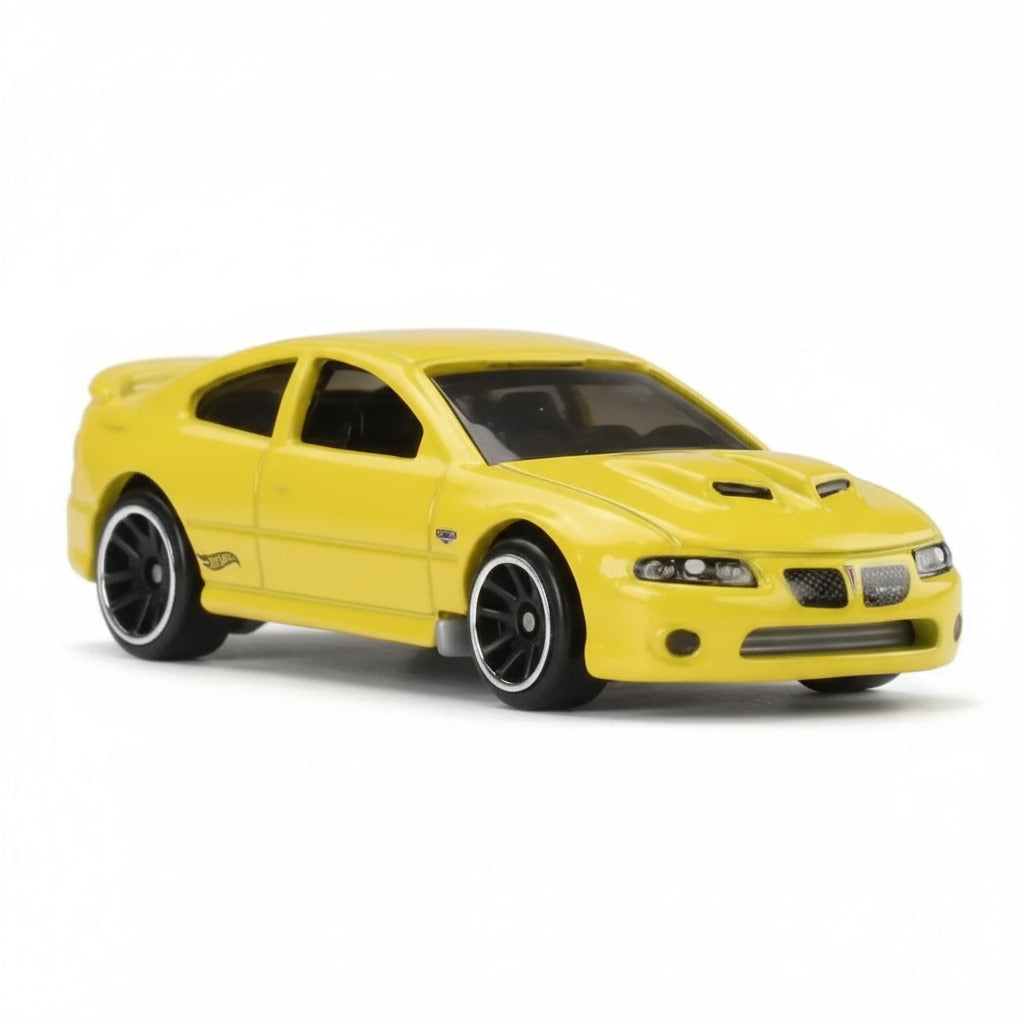 Miniatura coleccionable Pontiac GTO 2006 Hot Wheels color amarillo vista frontal
