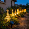 Set 10 estacas solares LED arbolitos navidad acrílico luz cálida fondo blanco