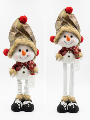 Muñeco de nieve navidad patas largas junto a árbol decorado living chileno